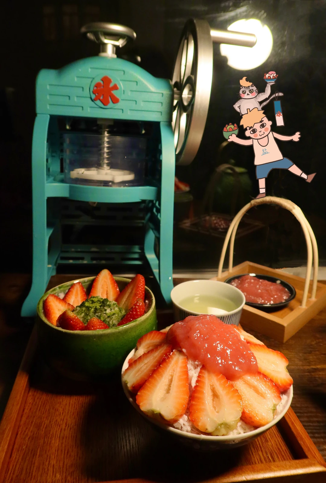 Strawberry shaved ice beside a vintage ice shaver